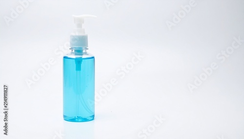 Hand sanitizer gel in a clear plastic pump bottle blue liquid soap or disinfectant for hygiene and health protection