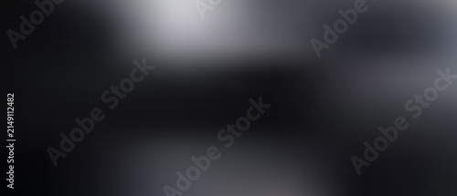 Abstract blurred background, with dark gray, and black gradient tones