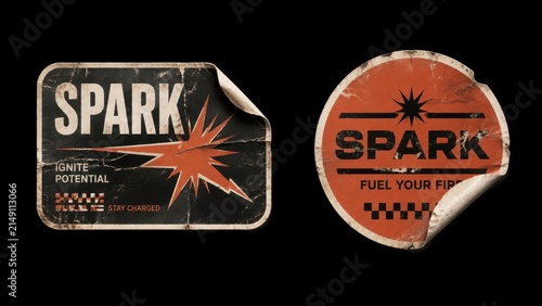 Two worn retro spark stickers isolated on black background