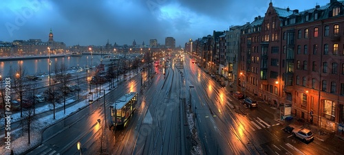 Rainy Evening in Copenhagen - City Lights Reflecting on Wet Streets.