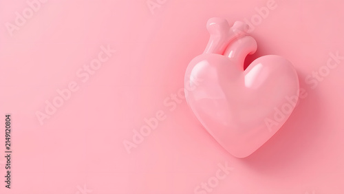 Glossy Pink Heart-Shaped Anatomical Heart Against a Solid Pink Background