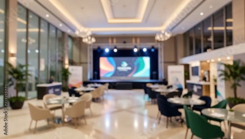 Blurred conference hall ballroom event space corporate meeting interior luxury banquet gala venue stage lighting hotel lobby background
