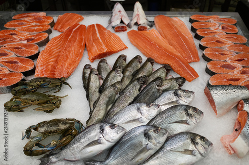 Fresh fish and seafood selection at a market in the early morning