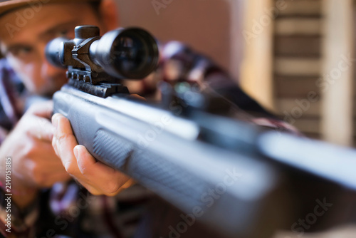 Man aiming with rifle