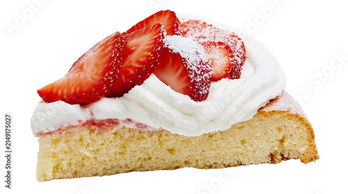 Slice of sponge cake with whipped cream and fresh strawberries dusted with powdered sugar