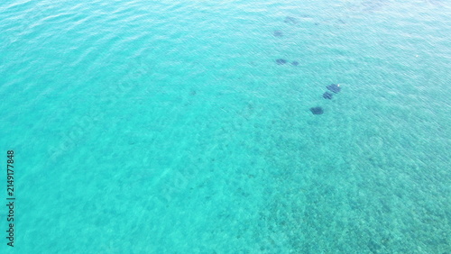 Top down aerial view of crystal clear turquoise sea water texture background