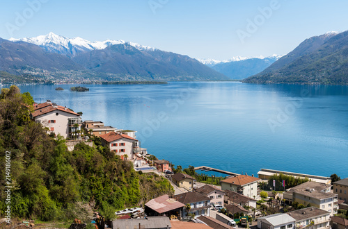Landscape of Lake Maggiore with the Brissago Islands surrounded by the Swiss Alps in the canton of Ticino, Brissago, Switzerland.