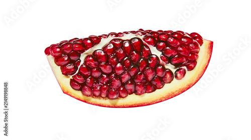 Картината върху платно Pomegranate slice with juicy red arils and white pith