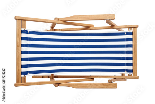 Folded wooden beach chair with blue striped canvas