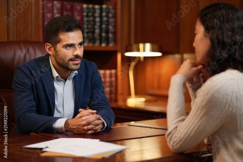 Lawyer Consulting Client in Office