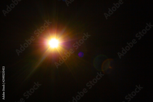 Sun flare on the black background