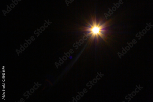 Sun flare on the black background