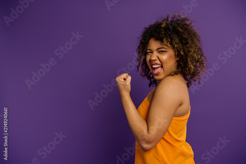 Fotografie Vibrant style and joyful spirit of a young African American woman expressing hap