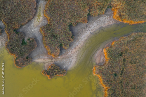 Aerial drone view of Lake Velence, Hungary, revealing severe drought, shrinking shoreline and dried wetlands during the summer.