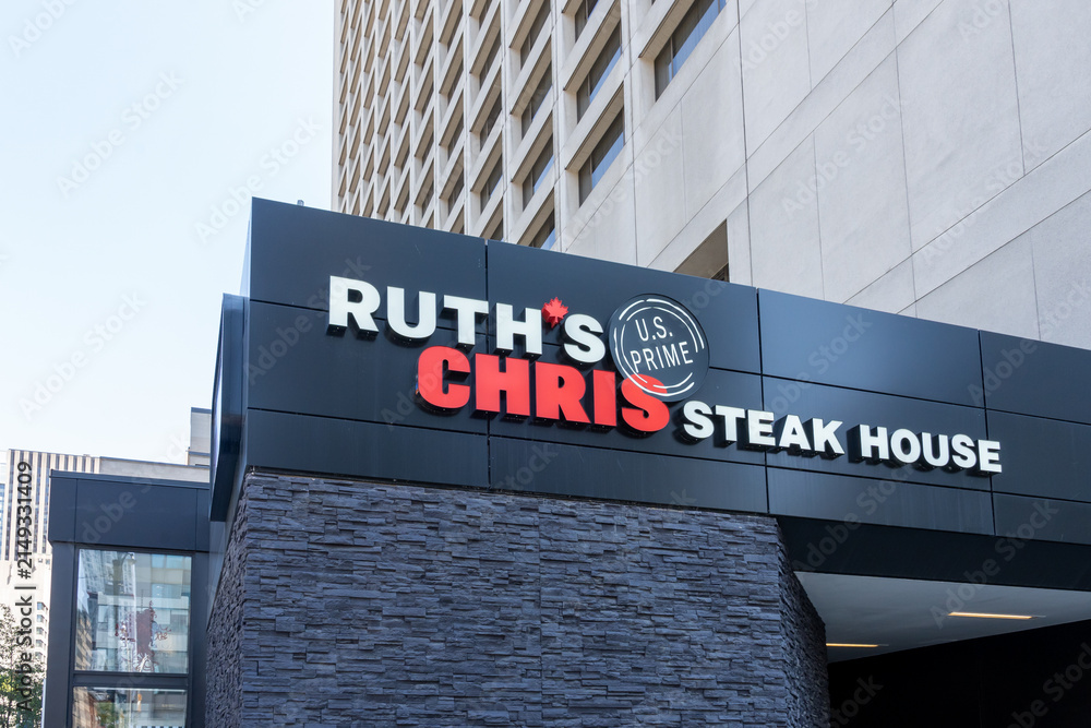 Fototapeta premium Toronto, Ontario, Canada - August 5, 2026: Ruth's Chris Steak House restaurant sign on the building in downtown Toronto, Ontario, Canada. 