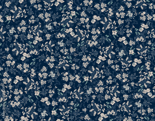 Delicate white floral pattern on deep navy background with subtle green accents for textile design