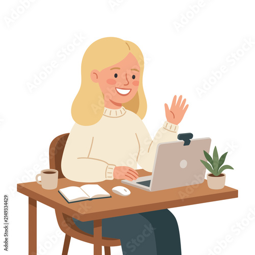 Smiling woman waving at laptop during video call