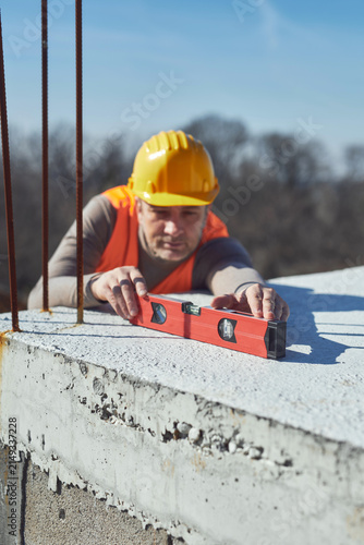 фотографія Construction worker working outdoors on a construction site.