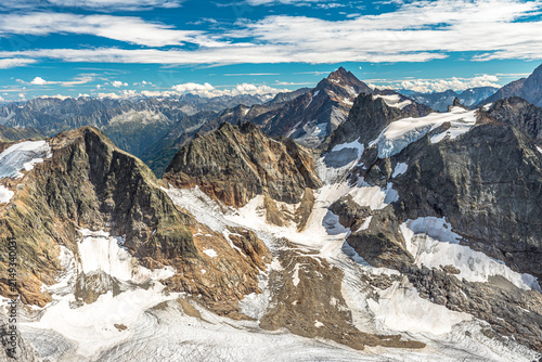 aerial view panorama from Titlis suspension bridge of Swiss Alps on top of Titlis glacier. Obwalden and Bern cantons. Switzerland, Europe in the summer season.
