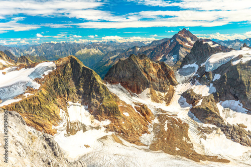 aerial view panorama from Titlis suspension bridge of Swiss Alps on top of Titlis glacier. Obwalden and Bern cantons. Switzerland, Europe in the summer season.