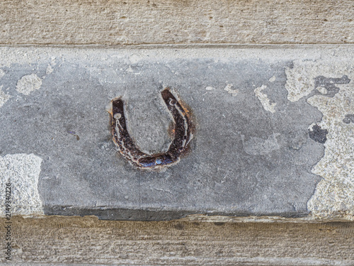 RIGA, LATVIA – JULY 28, 2017: Horseshoe Embedded in a Stone Entrance Step at St. Peter’s Boutique Hotel as a Traditional Good Luck Charm
