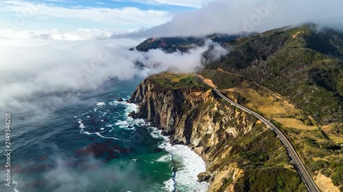 Aerial view of coastal cliffs and winding road.