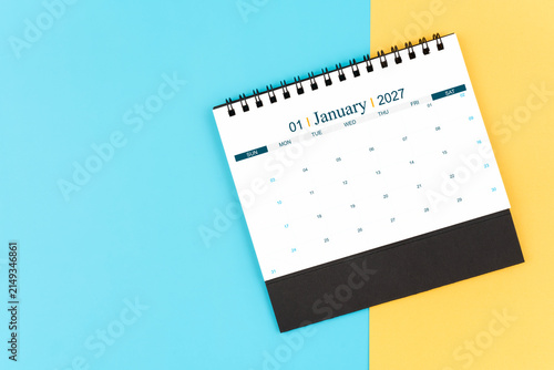 January 2027 desk calendar on blue and yellow, planning for business meeting or planning concept.