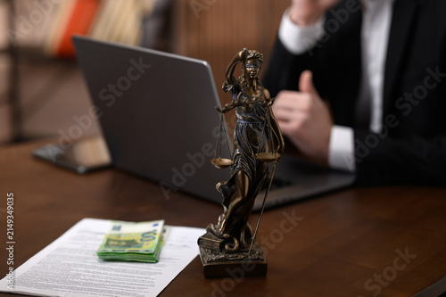 Canvastavla Bribery and Corruption Concept with Cash on Legal Documents and Lady Justice Sta