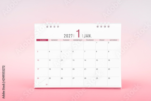 January blank desk calendar for 2027 year on pink color background.