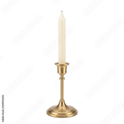 Fotografie Elegant brass candlestick with a tall ivory candle on a clean white background
