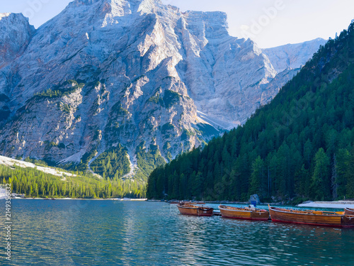 Bild auf Leinwand Boats on the Braies Lake in Dolomites mountains, Italy