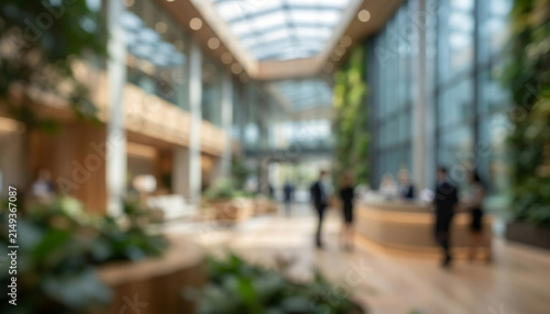 Fully blurred sustainable office lobby with abstract greenery, elegant reception forms and soft business silhouettes. Premium eco inspired commercial background for branding and marketing.