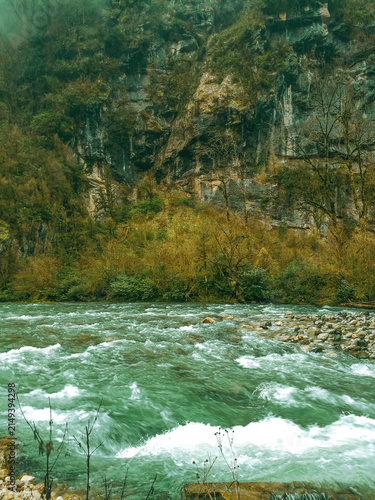 Photography Powerful turquoise mountain river rushing through a deep rocky gorge in Abkhazia