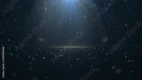 Magic glitter particles floating in dark space with blue light rays with glowing particles sparkles video magical glowing celebration background atmosphere sparkling