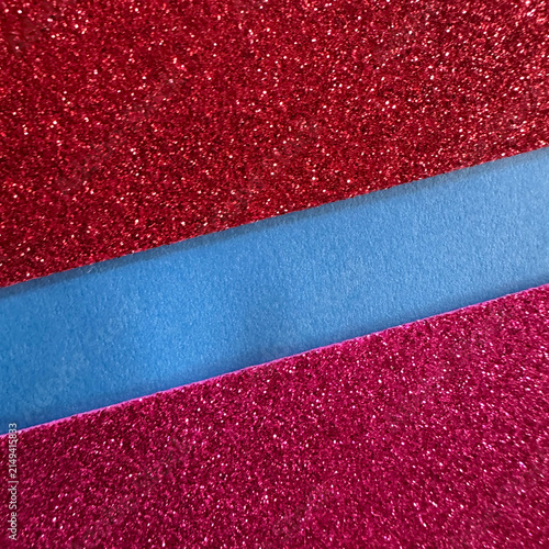 Red and magenta glitter paper strips separated by a blue matte ribbon
