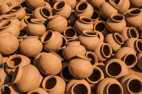 Many earthen pots stacked together