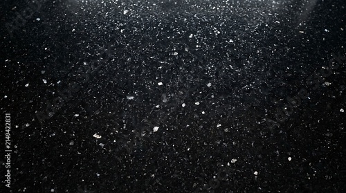 Abstract black granite texture background with sparkling white flecks with surface