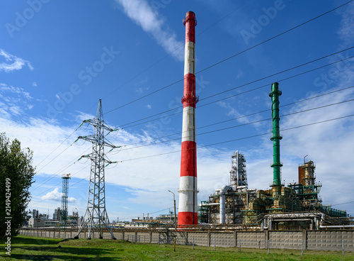 Obraz na plátně Colorful tall pipes, gas pipelines, tanks, ladders and other equipment for oil r