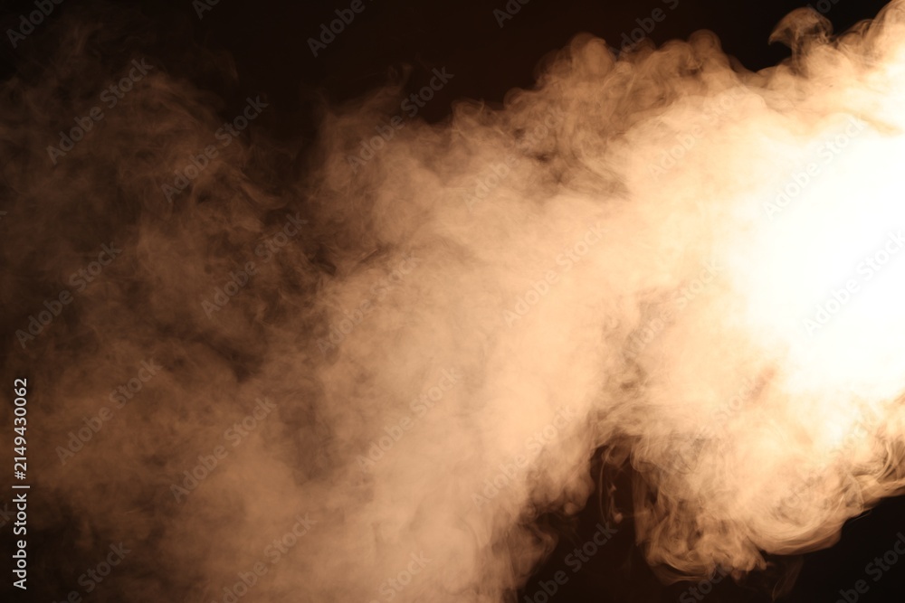 Fototapeta premium Beautiful smoke in neon light on dark background