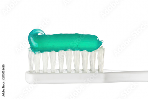 Obraz na plátne Blue gel toothpaste on a white toothbrush close up