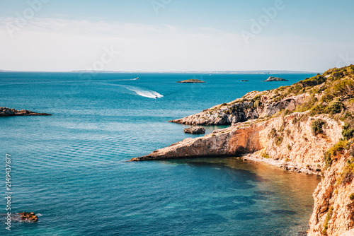Obraz na plátně View from Dalt Vila old town over turquoise Mediterranean sea with rocky coastli