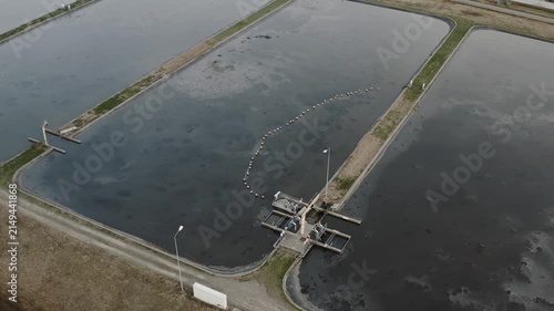 Water treatment infrastructure with wastewater basin, environmental engineering, purification, sewage management, aerial view.