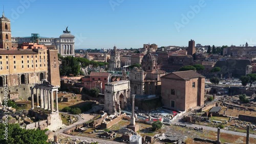 Aerial drone view over the historic center of Rome, Italy, featuring Capitoline Hill, the Altar of the Fatherland and the archaeological area of the Roman Forum. Panoramic view of Rome's historic arch