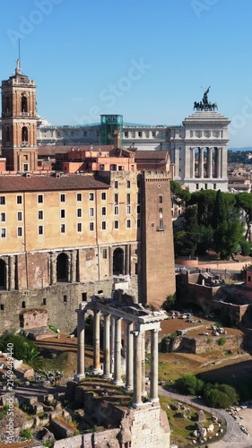Aerial drone view over the historic center of Rome, Italy, featuring Capitoline Hill, the Altar of the Fatherland and the archaeological area of the Roman Forum. Panoramic view of Rome's historic arch