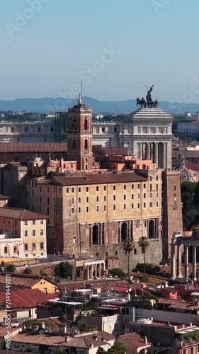 Aerial drone view over the historic center of Rome, Italy, featuring Capitoline Hill, the Altar of the Fatherland and the archaeological area of the Roman Forum. Panoramic view of Rome's historic arch