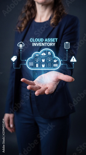 A woman in a suit holding her hand out with a digital cloud and icons floating above it, representing cloud asset inventory