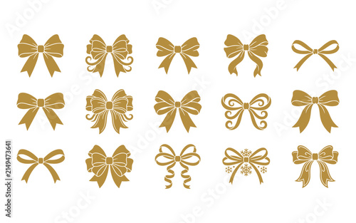 Set of various decorative gold gift bows and ribbons isolated on a white background for holiday design