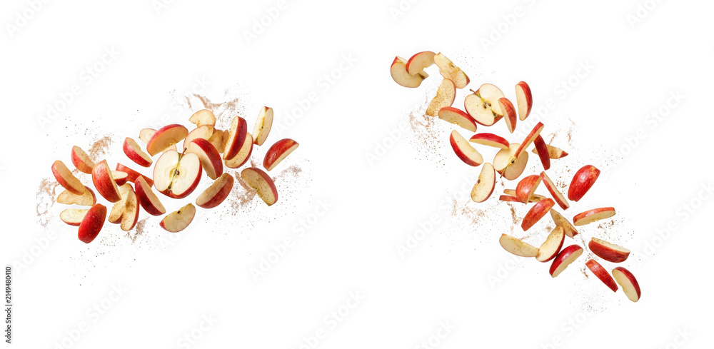 Fototapeta premium Fresh red apple slices floating in the air with cinnamon powder isolated on transparent background