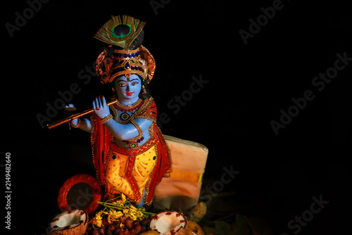 Canvastavla Beautiful golden Lord Krishna statue with flute decorated for traditional Hindu