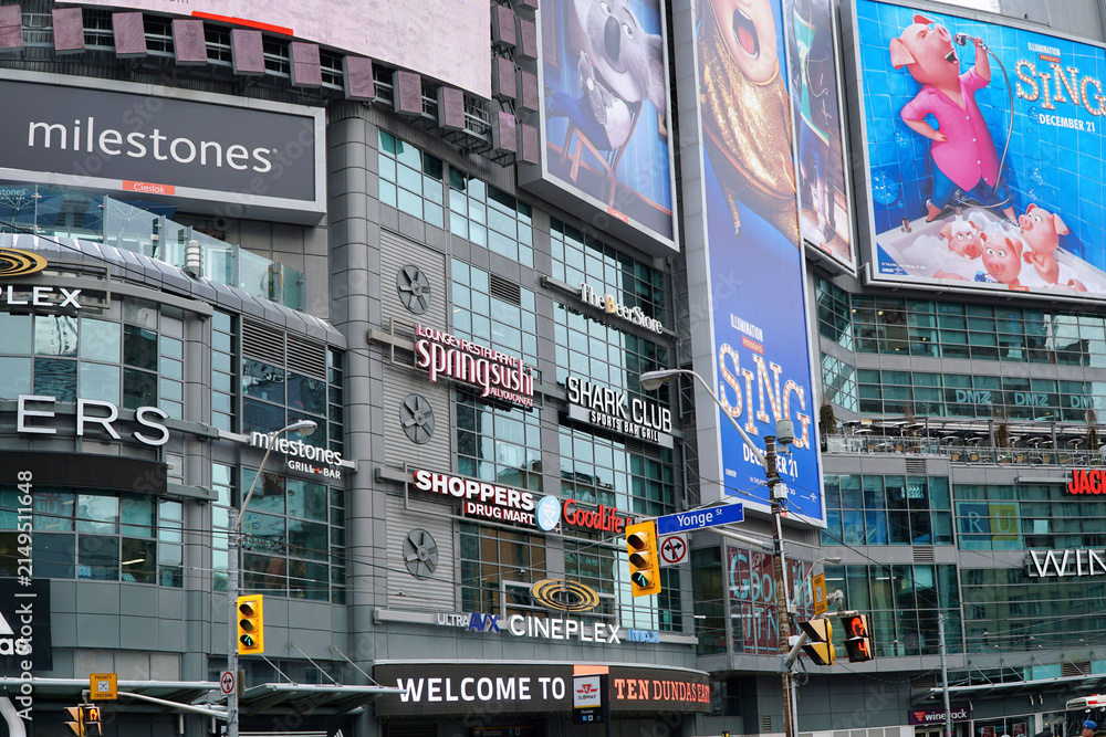 Fototapeta premium exterior of shoppiing center building with many advertisting signs and billboards